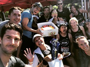 Mile2Marathon coach Rob Watson, left, who finished third in Saturday's Summerfast 10K, took great pride in winning the team championship cake. Gary Franco, shoting right by the box, took great pride in not sharing it!