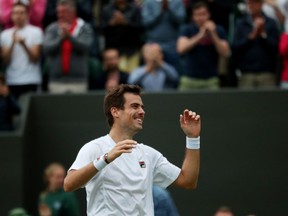 Argentina's Guido Pella celebrates after winning his fourth round match against Canada's Milos Raonic