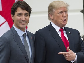 In this file photo taken on October 11, 2017 President Donald Trump welcomes Prime Minister Justin Trudeau at the White House in Washington, DC.