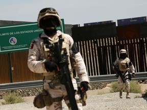 Members of the Mexican National Guard are seen at the U.S. and Mexico border to stop migrants from crossing into the United States, as seen from Anapra, in Ciudad Juarez, Mexico June 26, 2019.