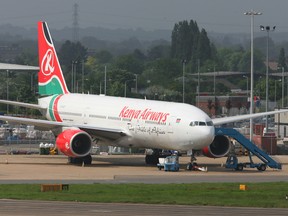 A Kenya Airways jet is parked at London's Heathrow International Airport, Thursday, May 18, 2006.