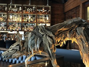 A driftwood sculpture of the restaurant’s namesake graces the upstairs room at The Wolf in the Fog.
