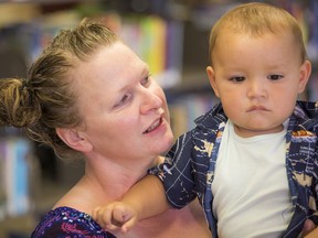 Anatta Watts holds her son, Sequoyah Watts. The Wattses are a Raise-a-Reader family who benefit from the Vancouver Public Library's Mother Goose program.
