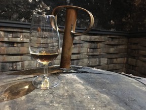 Cask of whisky with a valinch and dram inside the famous and historic No. 1 Vault at Bowmore Distillery on Islay, Scotland. Photo: Joanne Sasvari.