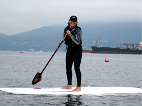 Ines Zagoudakis out for a paddle in Burrard Inlet where boaters face noise restrictions until well beyond residential areas.