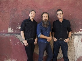 Calexico's Joey Burns and John Convertino and Iron & Wine's Sam Beam (centre) have joined forces for a new album. The tour comes to the Vogue Theatre Aug. 24.