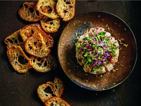 Scrupulously fresh fish is the key to Albacore Tuna Tartare, which is garnished with microgreens and served with crostini.