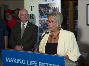 Judy Darcy, B.C.'s minister of mental health and addictions, speaks at Friday’s news conference in Surrey on tougher recovery house regulations and more money for those in recovery programs.
