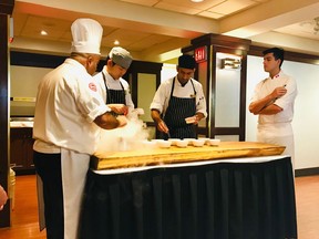 Chef Hamid Salimian uses liquid nitrogen for a dish with students at the Chef's Table. Photo: Mia Stainsby.