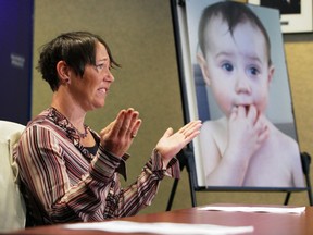 Tasha Brown speaks to the media at Saanich police headquarters in 2016. A photo of her missing daughter, Kaydance, is on an easel.