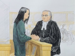 In this courtroom sketch by Jane Wolsak and released to AFP by the artist, Meng Wanzhou (L), Huawei's chief financial officer, speaks with lawyer David Martin in the courtroom in Vancouver, British Columbia on December 10, 2018.