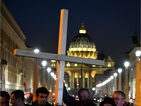 Members of Ending Clergy Abuse, a global organization of prominent survivors and activists, hold a cross during a protest on Feb. 21, 2019. Effective Wednesday in New York State, its new Child Victims Act, which is effective for one year, will scrap a statute of limitations that had barred older complaints from filing lawsuits over decades-old crimes.