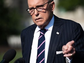In this file photo, taken Aug. 6, White House economic adviser Larry Kudlow speaks to the media on the driveway of the White House in Washington, DC.