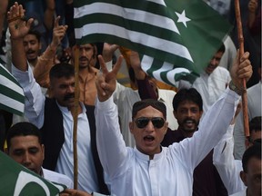 Demonstrators shout anti-Indian slogans while waving Pakistan-administered Kashmir flags during a protest in Karachi on Aug. 18. Tensions have soared since India earlier this month stripped the part of Kashmir that it controls of its autonomy, sparking calls from Pakistan for the international community to intervene on the decades-old issue.