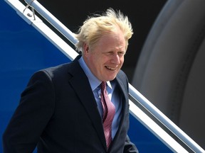 British Prime Minister Boris Johnson disembarks from a jet upon landing at the Biarritz Pays Basque Airport in Biarritz, France on Aug. 24, 2019, on the first day of the annual G7 Summit.