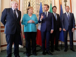 Left to right: Britain's Prime Minister Boris Johnson, German Chancellor Angela Merkel, French President Emmanuel Macron, Italian Premier Giuseppe Conte and President of the European Council Donald Tusk pose during a G7 coordination meeting with the Group of Seven European members in Biarritz, France, on Aug. 24, 2019, ahead of the G7 Summit.