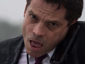 Former White House Communications Director Anthony Scaramucci speaks on the phone as he boards Air Force One at Andrews Air Force Base in Maryland on July 28, 2017.