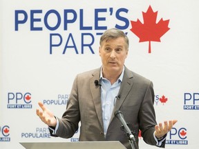 People's Party of Canada Leader Maxime Bernier speaks during a candidate nomination event in Montreal in January. Billboards with Bernier’s face and a slogan that reads 'Say NO to Mass Immigration' cropped up in Vancouver, Halifax and Regina on Friday.