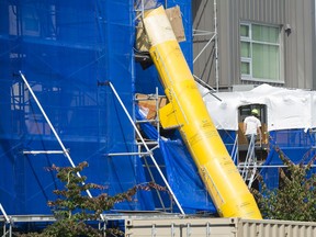 he Dunbar Apartments at 3595 West 17th Avenue are behind scaffolding as repairs are made to the nine year old building.