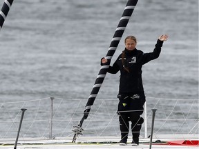 Swedish teenage climate activist Greta Thunberg waves from a yacht as she starts her trans-Atlantic boat trip to New York, in Plymouth, Britain.