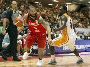 Canada's Cory Joseph (6) drives past the Virgin Islands' Khalid Hart (5) during FIBA World Cup qualifier action at TD Arena. July 2, 2018. (Errol McGihon/Postmedia)