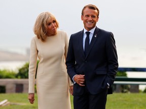 French President Emmanuel Macron and his wife Brigitte wait to welcome leaders of the G7 nations at the G7 Summit in Biarritz, France, on Aug. 24, 2019.