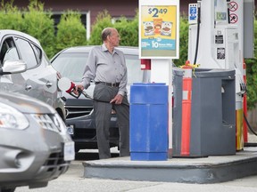 Drivers in Vancouver line up to fuel their cars ahead of the Labour Day weekend with lower priced gas at the Shell station at 12th and Clark on Friday, Aug. 30.