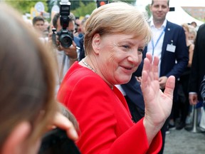 German Chancellor Angela Merkel waves during the government's Open Door Day in Berlin, on Aug. 18.