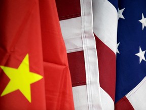FILE PHOTO: Flags of U.S. and China are displayed at American International Chamber of Commerce (AICC)'s booth during China International Fair for Trade in Services in Beijing, China, May 28, 2019. REUTERS/Jason Lee/File Photo ORG XMIT: FW1