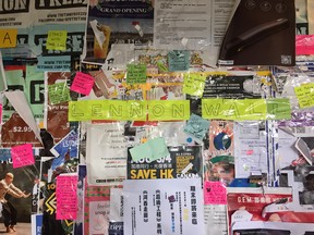 Messages on this SFU Lennon Wall have been reinforced with transparent tape because so many messages in support of Hong Kong protesters have been torn down.