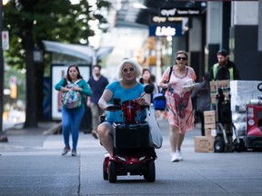 Jessica Yaniv, centre, arrives for a B.C. Human Rights Tribunal hearing in Vancouver, on Friday July 26, 2019.