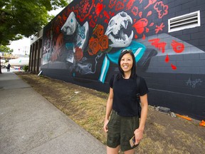 Lisa Wong, marketing manager for the Vancouver Mural Festival, is shown in front of Kathy Ager's mural, one of 25 in the 2019 edition of the festival. Photo: Francis Georgian