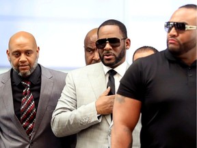 R. Kelly walks inside the Criminal Court Building in Chicago, Illinois on June 6. Kelly is facing sexual misconduct charges in New York City, Chicago and in Cook County, Illinois.