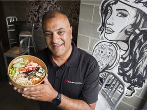 Faizzal Fatehali holds up a vegan Shaka Sushi bowl from Buddha-Full that will offered at this year's PNE.