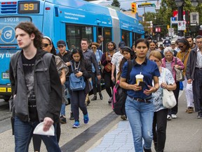 The Census shows about 17 per cent of non-immigrant commuters rely on transit, compared to about 36 per cent of recent immigrant commuters and 45 per cent of non-permanent residents. (Photo: People leave the bus at a B-Line stop in Vancouver)