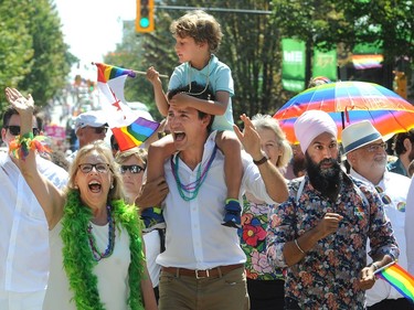VANCOUVER, BC., August 4, 2019 -  Canadian Prime Minister Justin Trudeau with son, Hadrian, Elizabeth May and Jagmeet Singh marches in the 2019 Vancouver Pride Parade in Vancouver,  BC., August 4, 2019.  (NICK PROCAYLO/PNG)   00058300A ORG XMIT: 00058300A [PNG Merlin Archive]