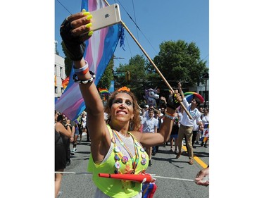 VANCOUVER, BC., August 4, 2019 - A parade participant snaps a selfie as Canadian Prime Minister Justin Trudeau marches in the 2019 Vancouver Pride Parade in Vancouver,  BC., August 4, 2019.  (NICK PROCAYLO/PNG)   00058300A ORG XMIT: 00058300A [PNG Merlin Archive]