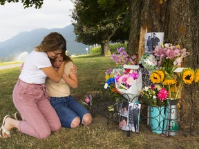 Two neighbors are overcome by grief at the site of a crash that killed a young couple at 20-19.