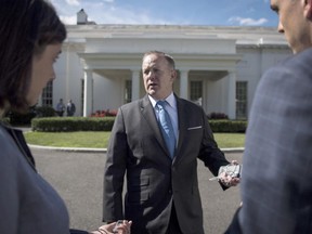 Sean Spicer talks with reporters and members of the media outside the West Wing on July 25, 2017 - days after he announced his departure from the White House.