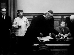 German Nazi Foreign Minister Joachim Von Ribbentrop (L), Soviet head of state Joseph Stalin (2nd L) and his Foreign Minister Vyacheslav Molotov (R) are seen on 23 August 1939 in Kremlin in Moscow during the signing the Soviet-German Non-Aggression Pact, or Treaty of Non-aggression between Germany and the Union of Soviet Socialist Republics, making the outbreak of war virtually inevitable.