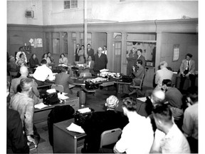 Vancouver News-Herald owner Roy Thomson, white-haired man with glasses in the middle, tells the staff that he's closing the newspaper, in June 1957. The paper's publisher, Gerald Brown, is standing with his arms crossed to Thomson's left.