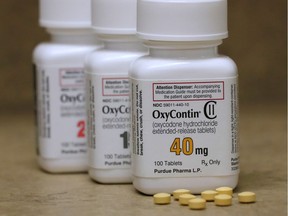 Bottles of prescription painkiller OxyContin pills, made by Purdue Pharma sit on a counter at a local pharmacy in Provo, Utah.