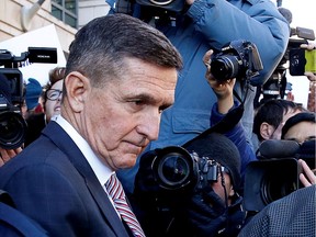 Former U.S. national security adviser Michael Flynn passes by members of the media as he departs after his sentencing was delayed at U.S. District Court in Washington, U.S., December 18, 2018.