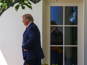 U.S. President Donald Trump walks out of the Oval Office in Washington,D.C. on August 21, 2019. Environmental and animal rights groups on Wednesday sued the Trump administration over its proposal to revise the U.S. Endangered Species Act.