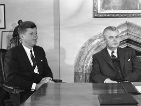 U.S. President John Kennedy (R) and Prime Minister John Diefenbaker meet to begin talks on U.S. and Canadian problems in Ottawa, Canada in this May 17, 1961 file photo.