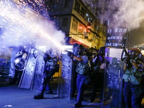 Police fire tear gas at anti-extradition bill protesters during clashes in Sham Shui Po in Hong Kong, China, August 14, 2019.