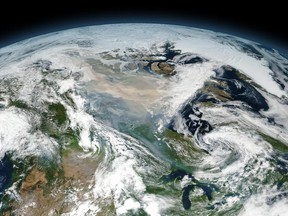 An enormous cloud of smoke from intense wildfires drifted over northern Canada on August 15, 2017. The image is a mosaic composed from several satellite overpasses because the affected area was so large.