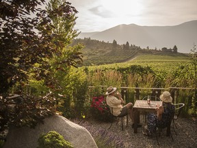 A couple enjoys a wine tasting at the Baillie-Grohman Estate Winery in Creston, BC.