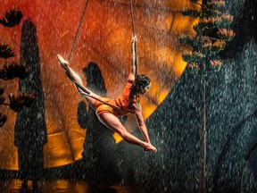 Roue Cyr performs on trapeze in Cirque du Soleil's Luzia.