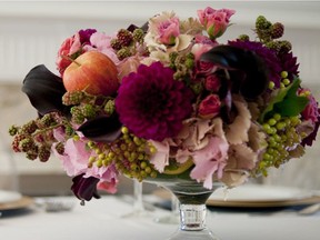 Floral and fruit bouquet by Hilary Miles Flowers. Photo credit: Hilary Miles Flowers for The Home Front: Down to earth Thanksgiving decor by Rebecca Keillor [PNG Merlin Archive]